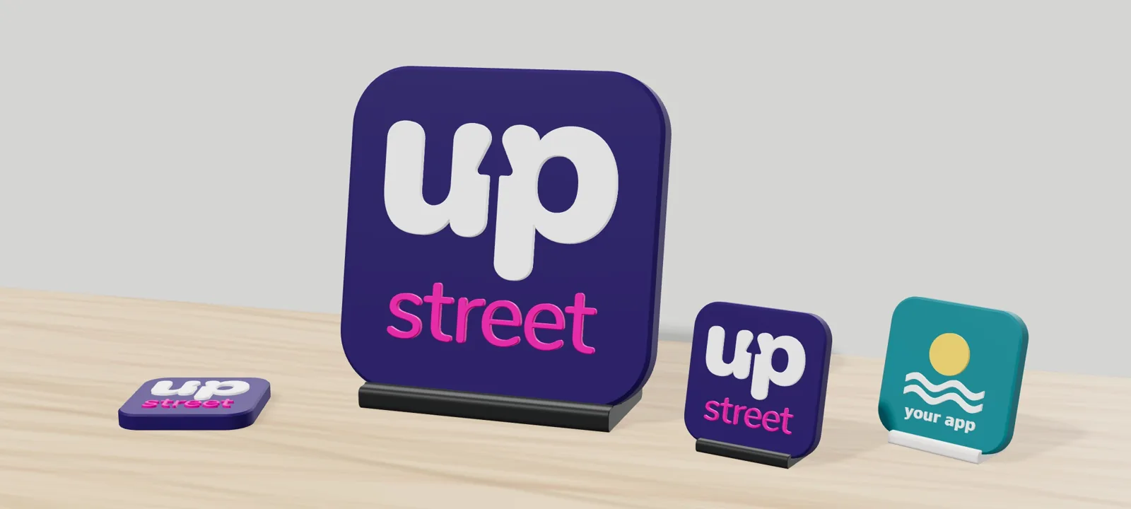 The range on a desk: Mini Icon paperweight, Desk Icon, Mini Icon on its stand and an example icon